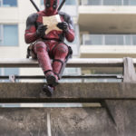 DEADPOOL  Ryan Reynolds as Deadpool relaxes before leaping into battle.  Photo Credit: David Dolsen  TM & © 2015 Marvel & Subs.  TM and © 2015 Twentieth Century Fox Film Corporation.  All rights reserved.  Not for sale or duplication.