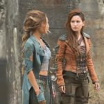 L to R: Lyria (Vanessa Morgan) and Eretria (Ivana Baquero) star in 