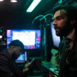 In From The Cold. (L to R) Charles Brice as Chris, Cillian O'Sullivan as Chauncey in episode 101 of In From The Cold. Cr. Enrique Baró Ubach/Netflix © 2021