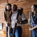 (from left) Wen (Kristen Cui), Leonard (Dave Bautista) and Adriane (Abby Quinn) in Knock at the Cabin, directed by M. Night Shyamalan.