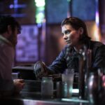 Lauren Cohan as Maggie Rhee, Charlie Solis as Bartender - The Walking Dead: Dead City _ Season 1, Episode 1 - Photo Credit: Peter Kramer/AMC