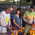 David Allen Burns and Austin Young of Fallen Fruit with Zooey Deschanel at Stoneview Nature Center, as seen on What Am I Eating? With Zooey Deschanel, Season 1.