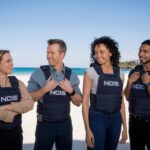 L-R: Tuuli Narkle as AFP Liaison Officer Constable Evie Cooper, Todd Lasance as AFP Liaison Officer Sergeant Jim  'JD' Dempsey, Olivia Swann as NCIS Special Agent Captain Michelle Mackey and Sean Sagar as Special Agent DeShawn Jackson at Bondi Beach, on the set of NCIS: Sydney. 

PHOTO CREDIT: Daniel Asher Smith/Paramount+   

© TM & © 2023 CBS Studios Inc. NCIS: Sydney and related marks and logos are trademarks of CBS Studios Inc. All Rights Reserved.