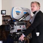 Writer, director, and producer Christopher Nolan on the set of OPPENHEIMER.