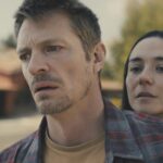 Joel Kinnaman as Godlock and Catalina Sandino as Saya in Silent Night. Photo Credit: Courtesy of Lionsgate