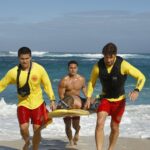 RESCUE: HI SURF:  L-R:  Alex Aiono, Kekoa Kekumano and Adam Demos. RESCUE: HI SURF premieres this Fall on FOX.  ©2024 Fox Media LLC. CR: Zack Dougan/FOX