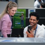 DMV (Mondays, 8:30-9:00 PM), based on award winning author Katherine Heiny’s short story, a single camera workplace comedy set at the place everyone dreads going most: the DMV. Our quirky and lovable characters are making minimum wage, doing a thankless job where customers are annoyed before they even walk in the door. Good thing they have each other.        Pictured (L-R): Harriet Dyer as Colette and Alex Tarrant as Noa. Photo: Bertrand Calmeau/CBS ©2025 CBS Broadcasting, Inc. All Rights Reserved.