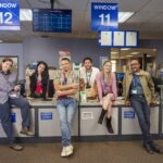 DMV (Mondays, 8:30-9:00 PM), based on award winning author Katherine Heiny’s short story, a single camera workplace comedy set at the place everyone dreads going most: the DMV. Our quirky and lovable characters are making minimum wage, doing a thankless job where customers are annoyed before they even walk in the door. Good thing they have each other.     Pictured (L-R): Molly Kearney as Barbara, Gigi Zumbado as Jocelyn, Tony Cavaleiro as Vic, Alex Tarrant as Noa, Harriet Dyer as Colette, Tim Meadows as Gregg.    Photo: Matt Barnes/CBS ©2025 CBS Broadcasting, Inc. All Rights Reserved.