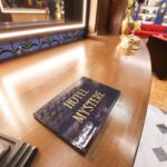 ‘Mystery Hotel Theme’ Set Plates of the Big Brother House for season 27 of the CBS Original Series BIG BROTHER, scheduled to air on the CBS Television Network.  Pictured: Reception Area: Houseguests are welcomed by a wall of 75 key boxes—some filled with eerie skeleton keys—and a raven mascot that hints at hidden meanings and BIG BROTHER history. Photo: Matthew Taplinger ©2025 CBS Broadcasting, Inc. All Rights Reserved.