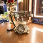 ‘Mystery Hotel Theme’ Set Plates of the Big Brother House for season 27 of the CBS Original Series BIG BROTHER, scheduled to air on the CBS Television Network.  Pictured: Reception Area: Houseguests are welcomed by a wall of 75 key boxes—some filled with eerie skeleton keys—and a raven mascot that hints at hidden meanings and BIG BROTHER history. Photo: Matthew Taplinger ©2025 CBS Broadcasting, Inc. All Rights Reserved.