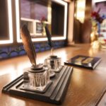 ‘Mystery Hotel Theme’ Set Plates of the Big Brother House for season 27 of the CBS Original Series BIG BROTHER, scheduled to air on the CBS Television Network.  Pictured: Reception Area: Houseguests are welcomed by a wall of 75 key boxes—some filled with eerie skeleton keys—and a raven mascot that hints at hidden meanings and BIG BROTHER history. Photo: Matthew Taplinger ©2025 CBS Broadcasting, Inc. All Rights Reserved.