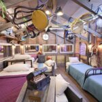 ‘Mystery Hotel Theme’ Set Plates of the Big Brother House for season 27 of the CBS Original Series BIG BROTHER, scheduled to air on the CBS Television Network.  Pictured: Attic Bedroom of Oddities: Beds made from wooden crates, rubber masks on the walls and haunted artifacts like a black knight’s helmet and diving suit make this room a spooky treasure trove. Photo: Matthew Taplinger ©2025 CBS Broadcasting, Inc. All Rights Reserved.