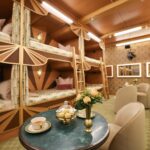 ‘Mystery Hotel Theme’ Set Plates of the Big Brother House for season 27 of the CBS Original Series BIG BROTHER, scheduled to air on the CBS Television Network.  Pictured: Sleeper Car Bunk Room: A train-themed bedroom with six-person bunk beds (a first time the BB house has had bunk beds since Season 1!) and sleek Art Deco design brings a vintage detective story to life. Photo: Matthew Taplinger ©2025 CBS Broadcasting, Inc. All Rights Reserved.