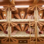 ‘Mystery Hotel Theme’ Set Plates of the Big Brother House for season 27 of the CBS Original Series BIG BROTHER, scheduled to air on the CBS Television Network.  Pictured: Sleeper Car Bunk Room: A train-themed bedroom with six-person bunk beds (a first time the BB house has had bunk beds since Season 1!) and sleek Art Deco design brings a vintage detective story to life. Photo: Matthew Taplinger ©2025 CBS Broadcasting, Inc. All Rights Reserved.