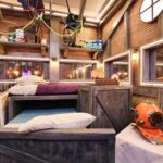 ‘Mystery Hotel Theme’ Set Plates of the Big Brother House for season 27 of the CBS Original Series BIG BROTHER, scheduled to air on the CBS Television Network.  Pictured: Attic Bedroom of Oddities: Beds made from wooden crates, rubber masks on the walls and haunted artifacts like a black knight’s helmet and diving suit make this room a spooky treasure trove. Photo: Matthew Taplinger ©2025 CBS Broadcasting, Inc. All Rights Reserved.