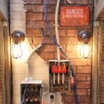 ‘Mystery Hotel Theme’ Set Plates of the Big Brother House for season 27 of the CBS Original Series BIG BROTHER, scheduled to air on the CBS Television Network.  Pictured: Attic Bedroom of Oddities: Beds made from wooden crates, rubber masks on the walls and haunted artifacts like a black knight’s helmet and diving suit make this room a spooky treasure trove. Photo: Matthew Taplinger ©2025 CBS Broadcasting, Inc. All Rights Reserved.