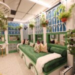 ‘Mystery Hotel Theme’ Set Plates of the Big Brother House for season 27 of the CBS Original Series BIG BROTHER, scheduled to air on the CBS Television Network.  Pictured: Victorian Conservatory Lounge: A lush, plant-filled room with a 13-foot green velvet lounge and a plum tree, perfect for quiet strategy sessions. Photo: Matthew Taplinger ©2025 CBS Broadcasting, Inc. All Rights Reserved.