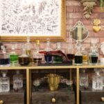 ‘Mystery Hotel Theme’ Set Plates of the Big Brother House for season 27 of the CBS Original Series BIG BROTHER, scheduled to air on the CBS Television Network.  Pictured: Venom Lounge & Poison Bar: Upstairs, snakes slither across the wallpaper in a moody lounge featuring a “Poison Bar,” (don’t worry, there is no actual poison) a velvet daybed, and ravens stealing party lights. Photo: Matthew Taplinger ©2025 CBS Broadcasting, Inc. All Rights Reserved.