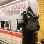 ‘Mystery Hotel Theme’ Set Plates of the Big Brother House for season 27 of the CBS Original Series BIG BROTHER, scheduled to air on the CBS Television Network.  Pictured: Boxing Ring Gym: The gym includes a full boxing ring, heavy bag and workout gear—ideal for blowing off steam and staying in top sleuthing shape. Photo: Matthew Taplinger ©2025 CBS Broadcasting, Inc. All Rights Reserved.