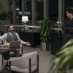 Lozini (Tony Shalhoub) and Kincaid (Nat Wolff) in PLAY DIRTY. Photo Credit: Jasin Boland/Prime © Amazon Content Services LLC