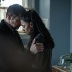 L-R: Jeremy Renner as Mike McLusky and Nishi Munshi as Tracy McLusky in Mayor of Kingstown season 4, streaming on Paramount+, 2025. Credit: Dennis P. Mong Jr./Paramount+   ©2025 Viacom International Inc. All Rights Reserved. Mayor of Kingstown and all related titles, logos and characters are trademarks of Viacom International Inc.