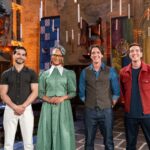 Judge Carla Hall and Judge Jozef Youssef and Hosts James and Oliver Phelps pose during judging, as seen on Harry Potter: Wizards of Baking, Season 2.