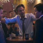 Elijah (Paul Walter Hauser), Santos (Benjamin Bratt), and Brad (Mark Wahlberg) in BALLS UP Photo Credit: Ben Rothstein Prime Video © Amazon Content Services LLC