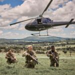 (LtoR) Charles Cottier as “Junior”, Damien Ryan as “White Dog” and Pacharo Mzembe as “Nico” in SEVEN SNIPERS. Photo Courtesy of Well Go USA.