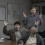 THE PAPER -- Episode 103 -- Pictured: (l-r) Alex Edelman as Adam, Duane R. Shepard as Barry, Domhnall Gleeson as Ned -- (Photo by: Aaron Epstein/PEACOCK)