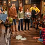 HAPPY'S PLACE -- 'Mouse in the House' Episode 206 -- Pictured: (l-r) Belissa Escobedo as Isabella, Pablo Castelblanco as Steve, Melissa Peterman as Gabby, Reba McEntire as Bobbie, Cheri Oteri as Inspector Monica, Rex Linn as Emmett, Tokala Black Elk as Takoda -- (Photo by: Casey Durkin/NBC)